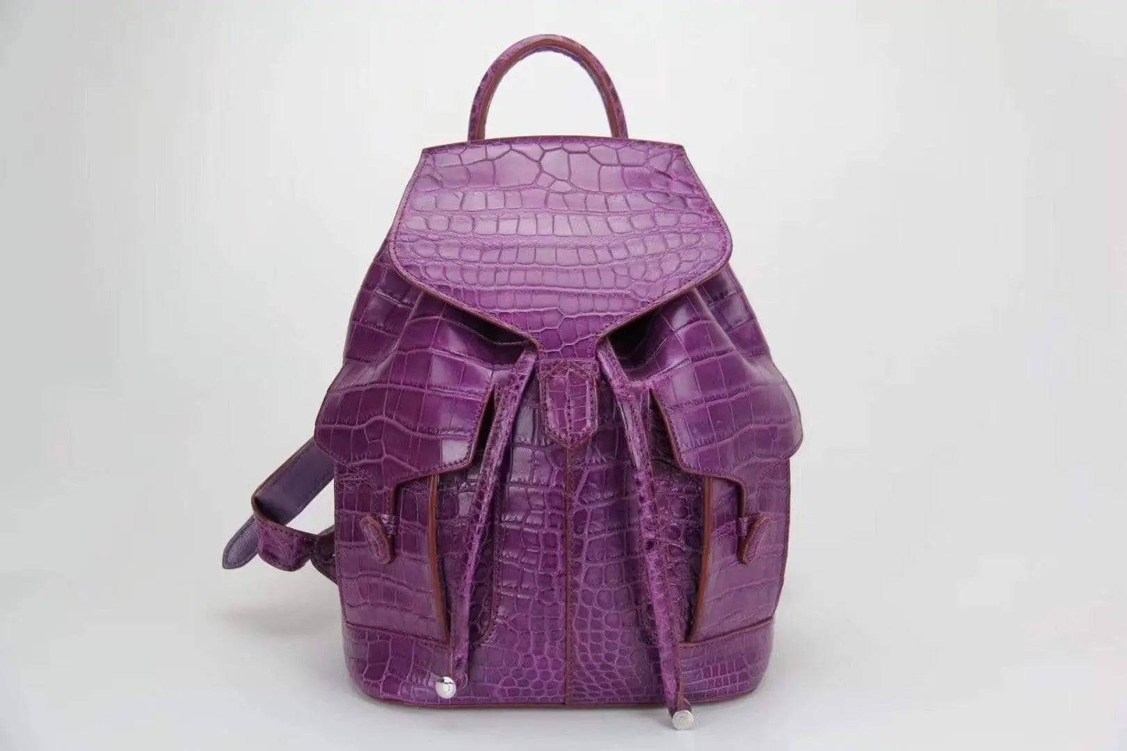 Genuine crocodile belly leather backpack handbag by Rossie Viren with textured crocodile skin and sleek design.