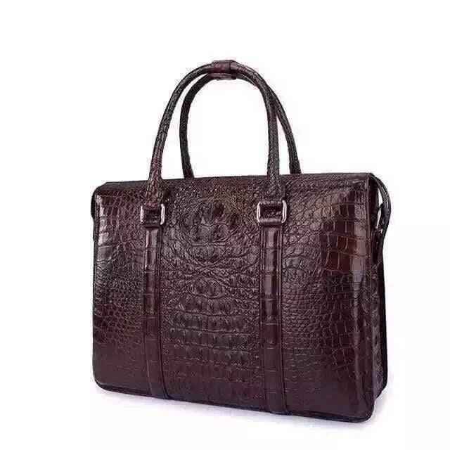 Genuine crocodile leather handbag by Rossie Viren, featuring a sleek briefcase design with sturdy handles and textured crocodile pattern.