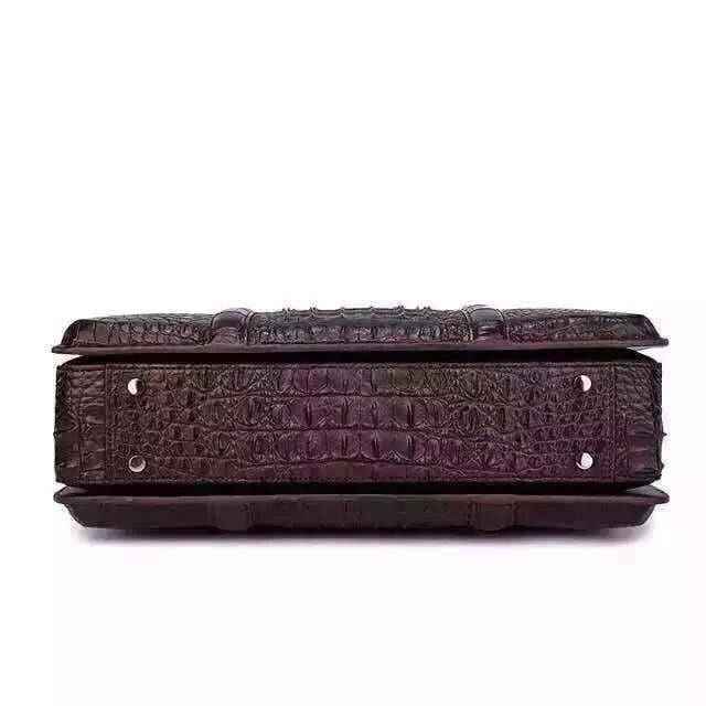 Genuine crocodile leather Rossie Viren handbag with sleek design and sturdy handle, showcasing luxurious texture and craftsmanship.