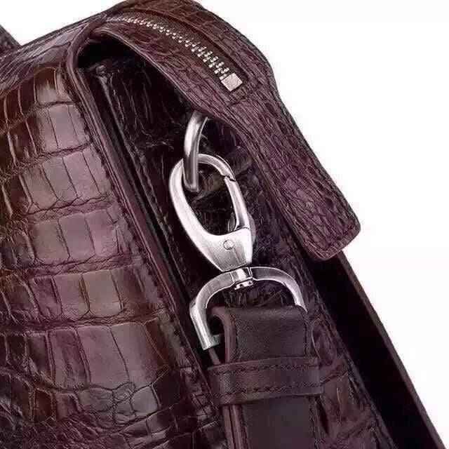 Genuine crocodile leather Rossie Viren handbag briefcase with polished finish and sturdy handle, showcasing luxurious craftsmanship.