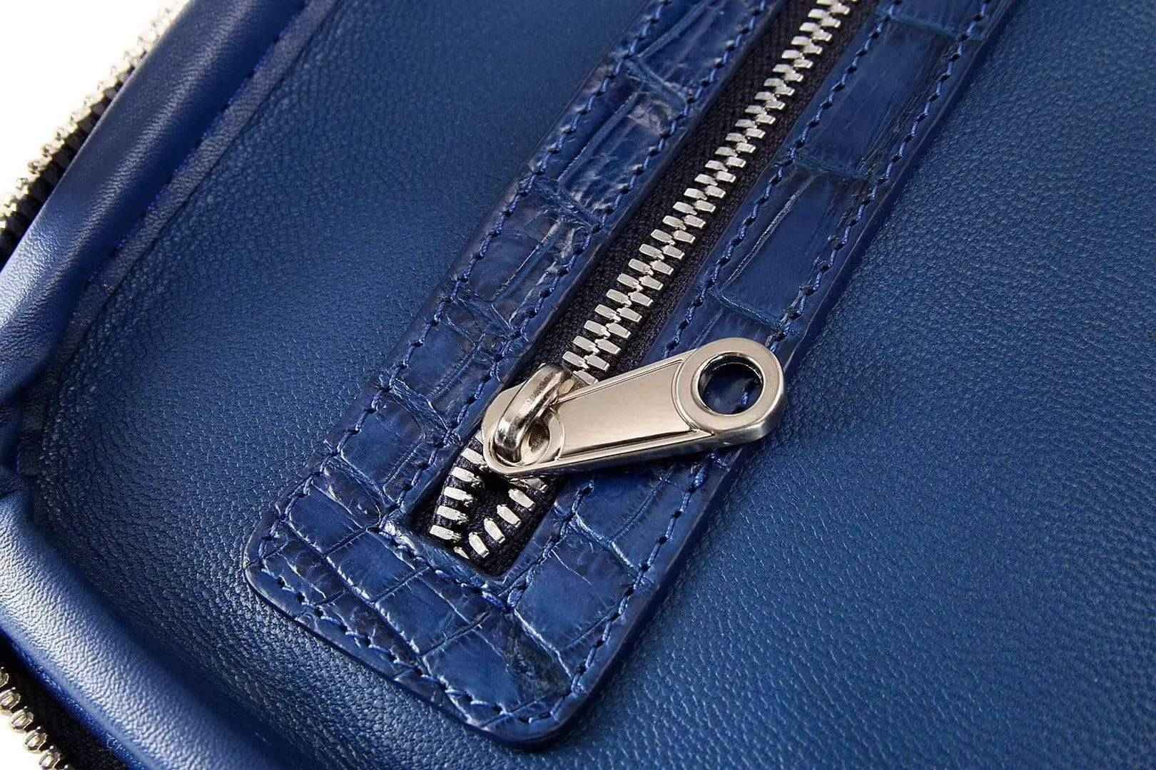 Rossie Viren genuine crocodile leather luggage roller trolley case with four spinner wheels and sturdy travel bag design.