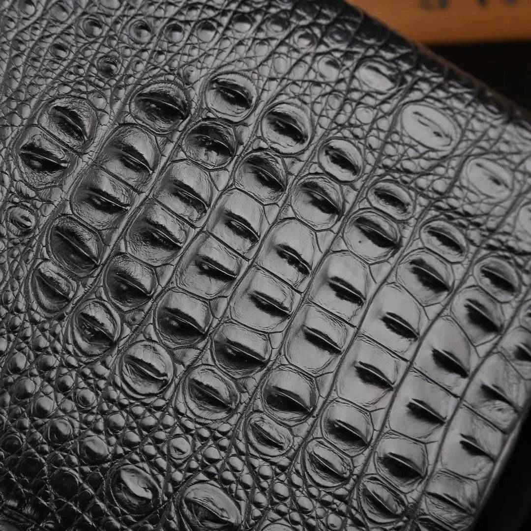 Genuine crocodile leather men's sling chest bag by Rossie Viren, featuring a sleek design and textured crocodile pattern.