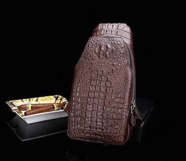 Genuine crocodile leather men's sling chest bag by Rossie Viren, featuring a sleek design with textured crocodile pattern.