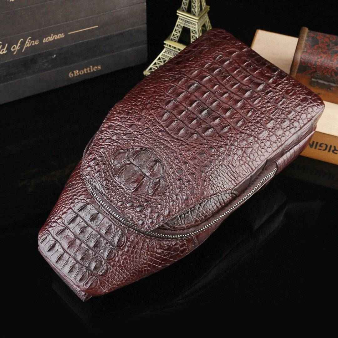 Genuine crocodile leather men's sling chest bag with adjustable strap by Rossie Viren, featuring a sleek, textured crocodile pattern.