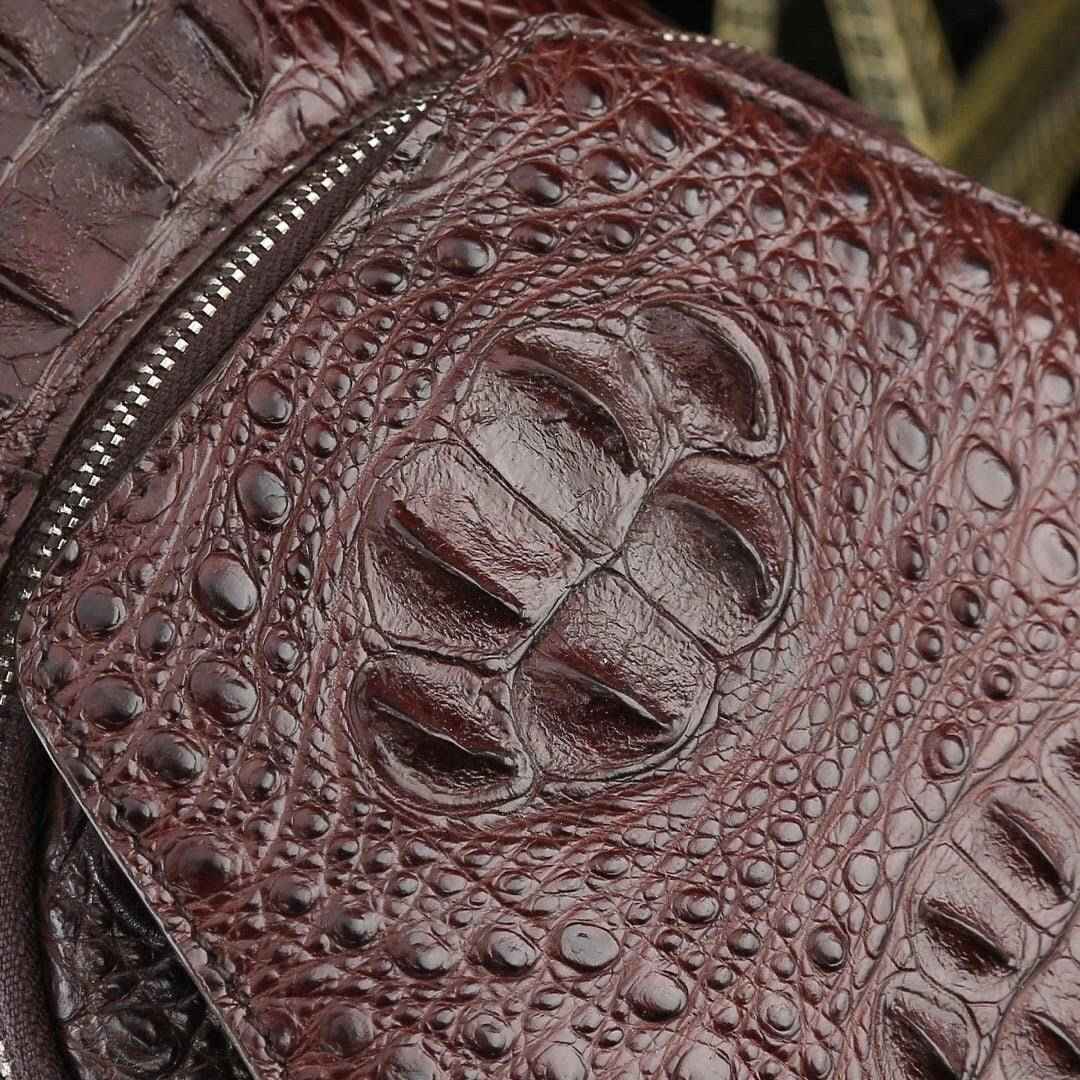 Genuine crocodile leather men's sling chest bag by Rossie Viren, featuring a sleek design and textured crocodile pattern.