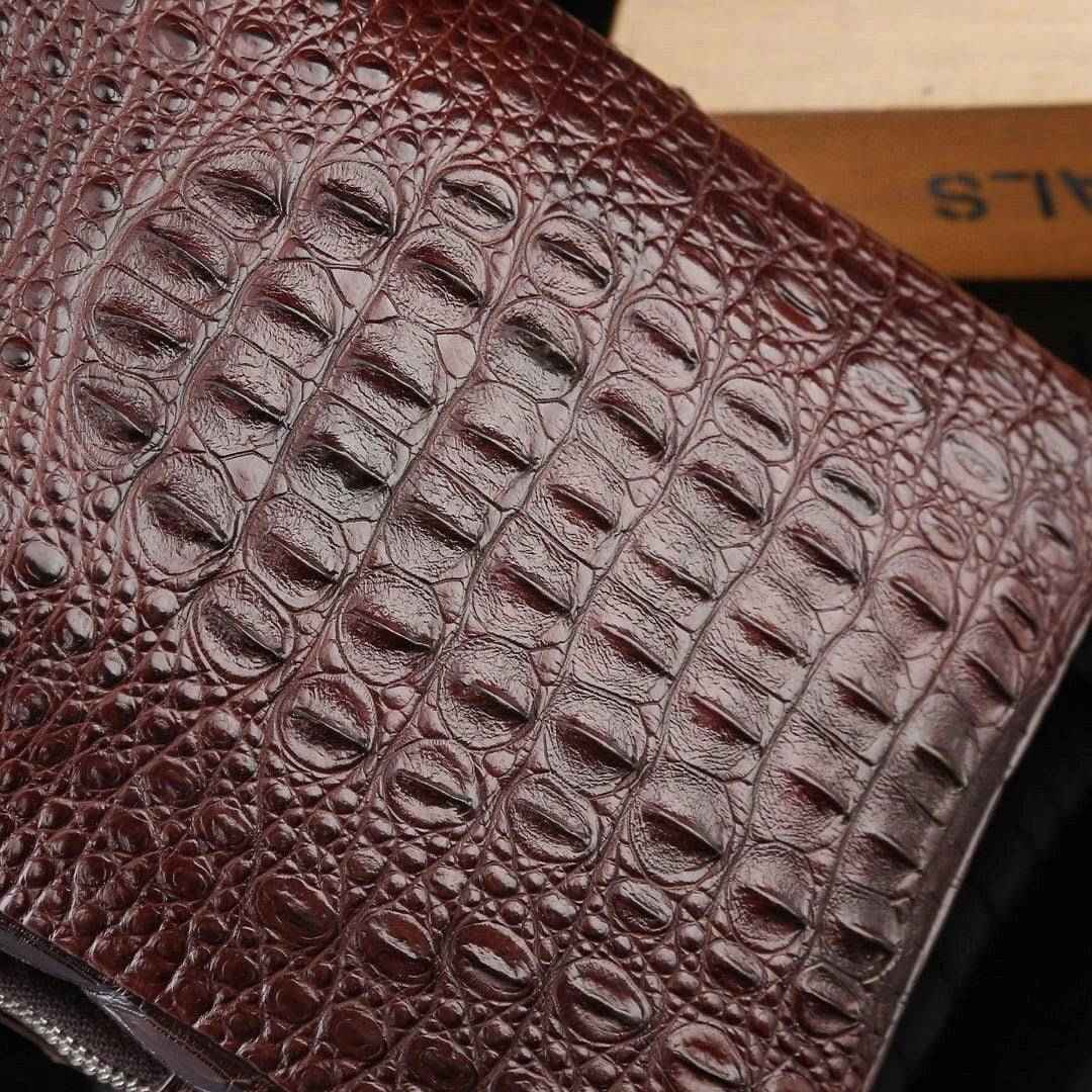 Genuine crocodile leather men's sling chest bag by Rossie Viren, featuring a sleek, textured crocodile skin design with adjustable strap.