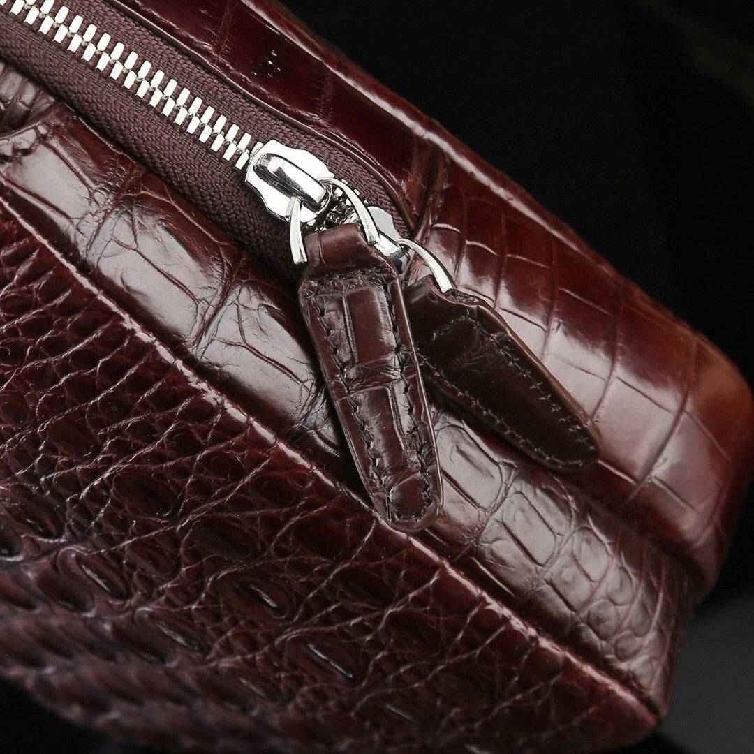 Genuine crocodile leather men's sling chest bag by Rossie Viren featuring a sleek, textured crocodile pattern and adjustable strap.