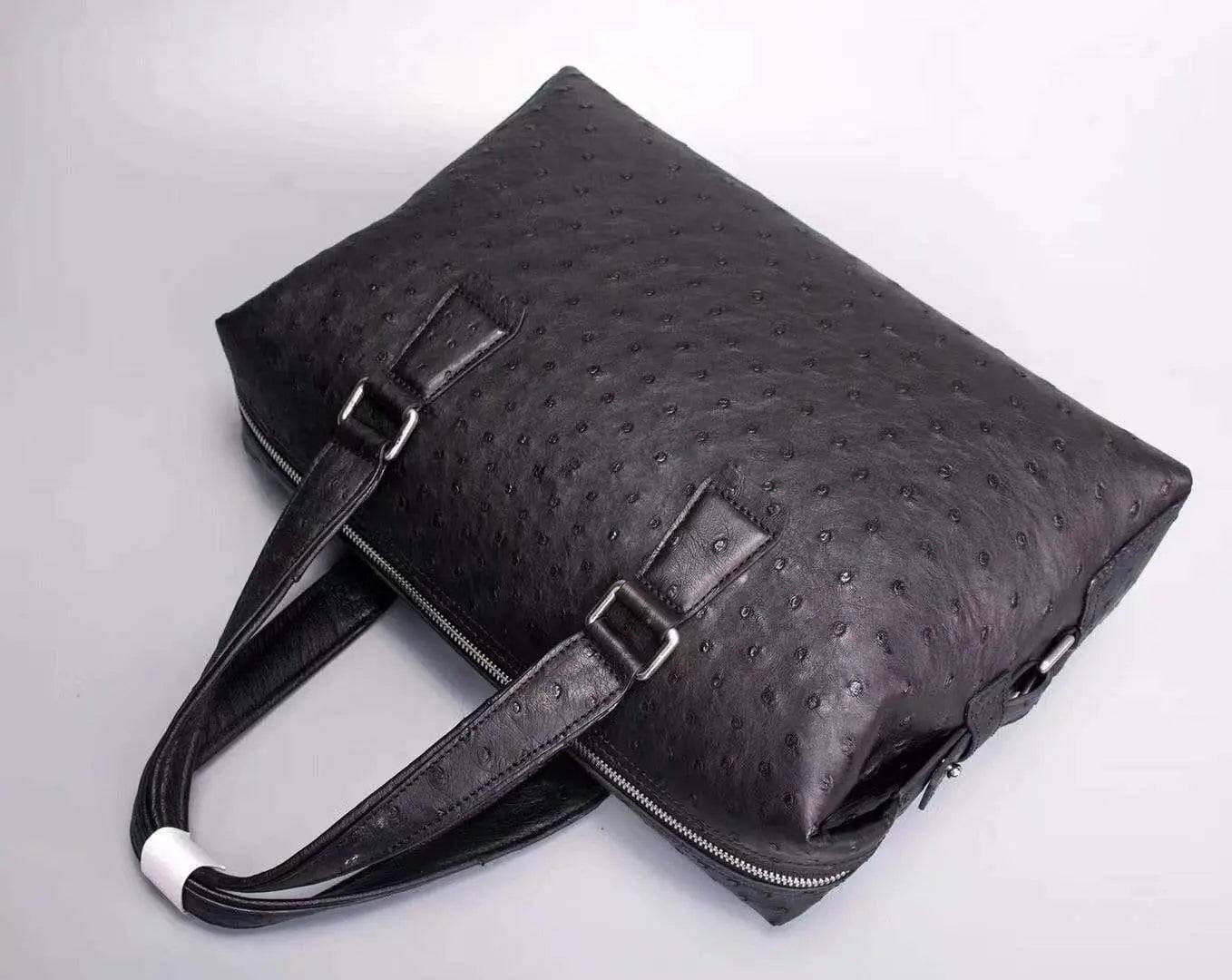 Black genuine ostrich leather briefcase tote bag by Rossie Viren with sleek design and textured leather surface.
