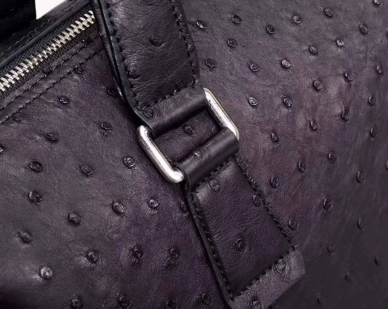 Black genuine ostrich leather briefcase tote bag by Rossie Viren, featuring a sleek design with textured leather and sturdy handles.