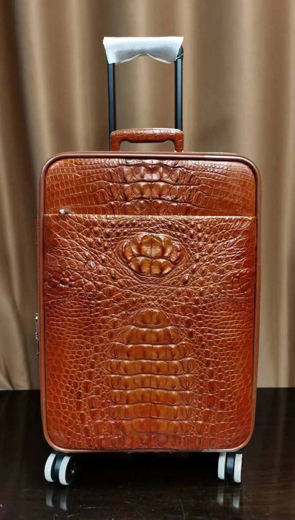 Rossie Viren genuine crocodile skin carry-on luggage suitcase with textured crocodile pattern and sturdy handles.