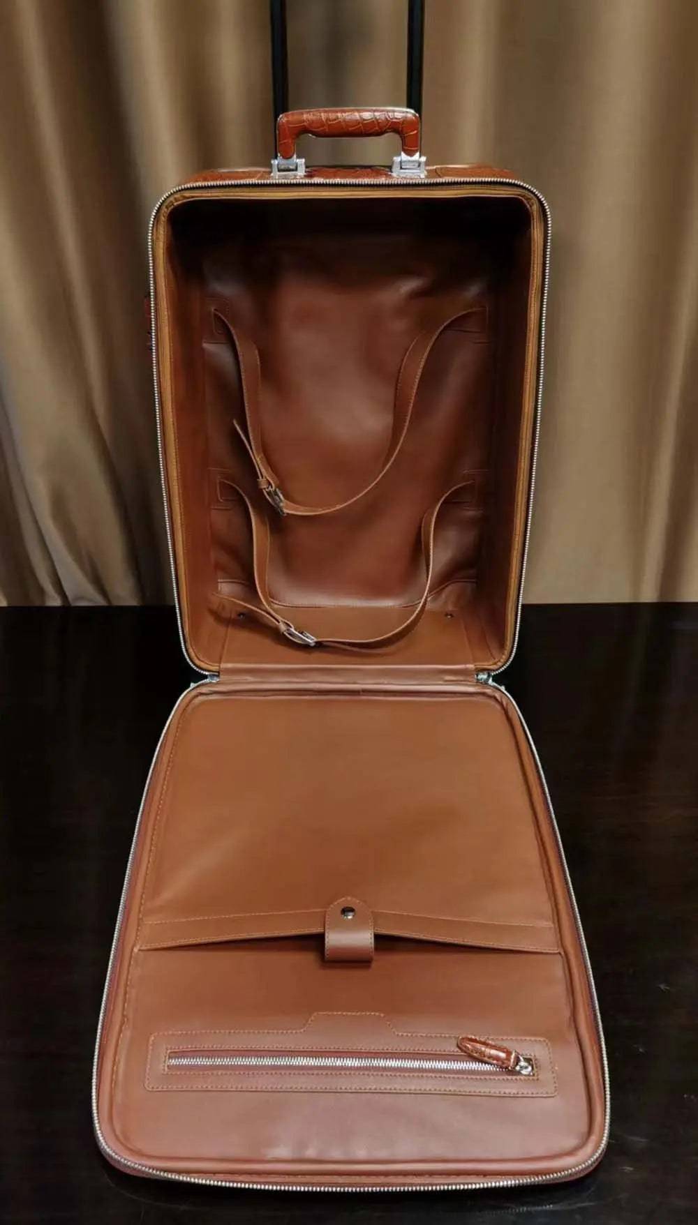 Rossie Viren genuine crocodile skin carry-on suitcase with polished finish and sturdy handle for travel.