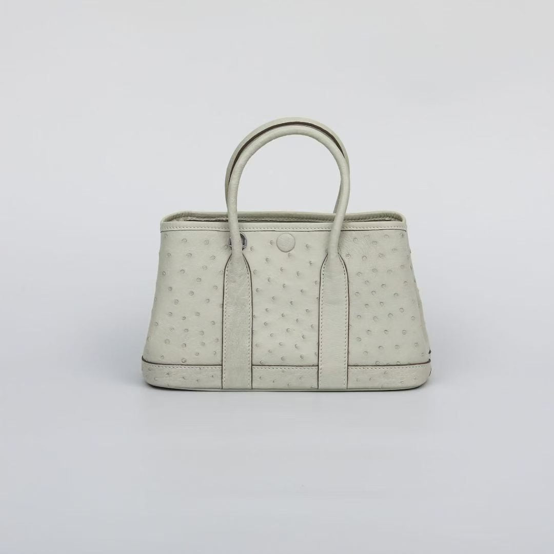 Genuine ostrich skin leather small tote bag by Rossie Viren, stylish handbag with textured surface and sturdy handles.
