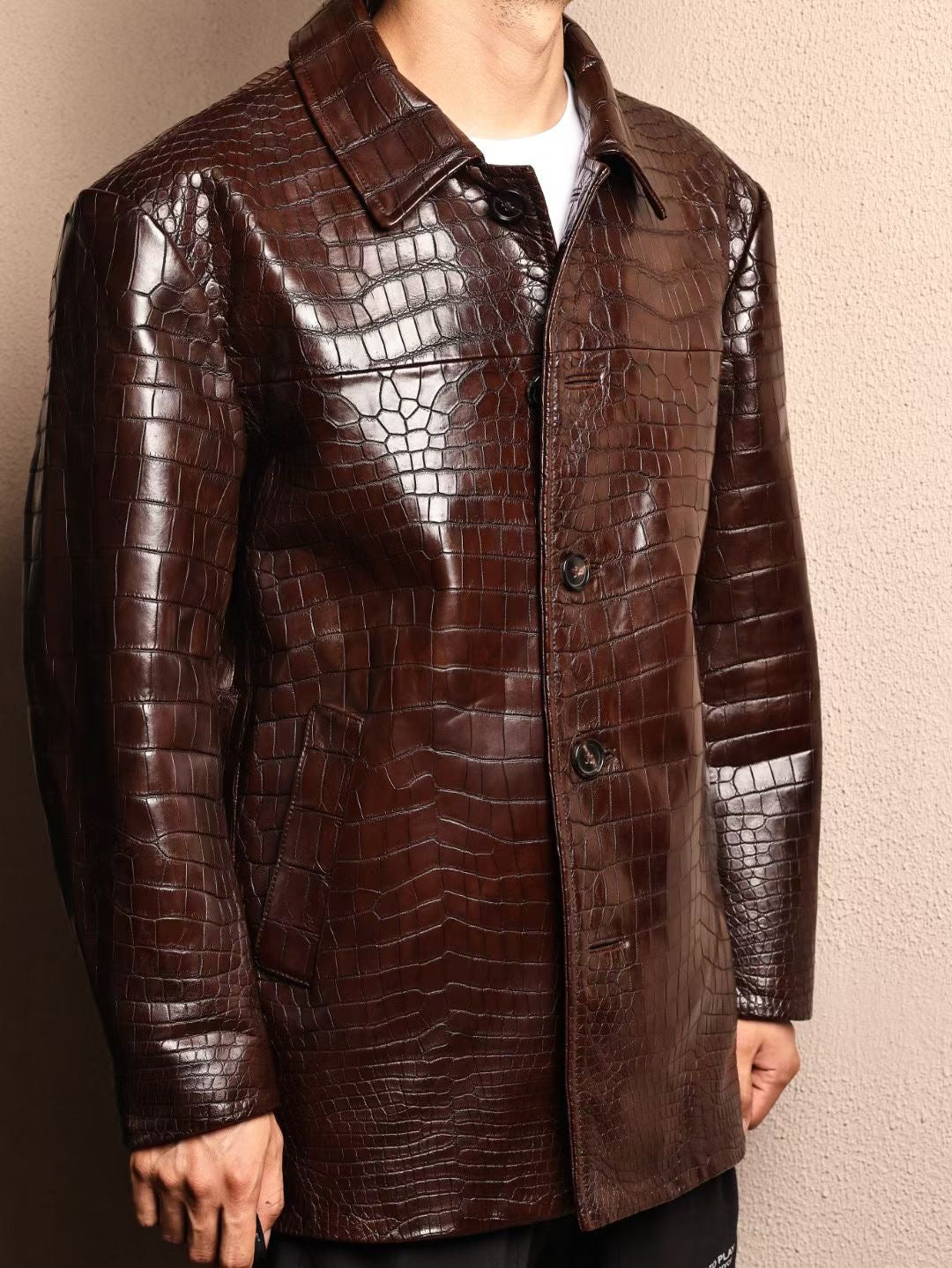 Men's mid-length crocodile leather jacket with mandarin collar, formal style, by Rossie Viren, featuring detailed crocodile skin texture.
