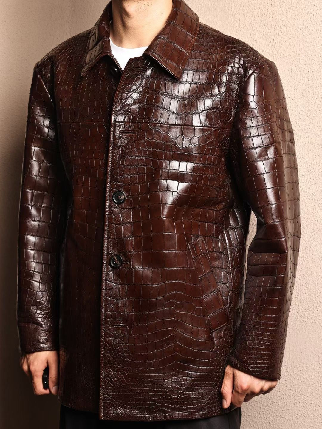 Men's mid-length crocodile leather jacket with Mandarin collar, formal design, from Rossie Viren, showcasing detailed crocodile skin texture.