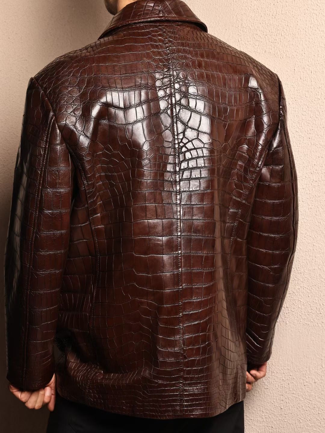 Men's mid-length crocodile leather jacket with Mandarin collar, formal style by Rossie Viren, displayed on a hanger.