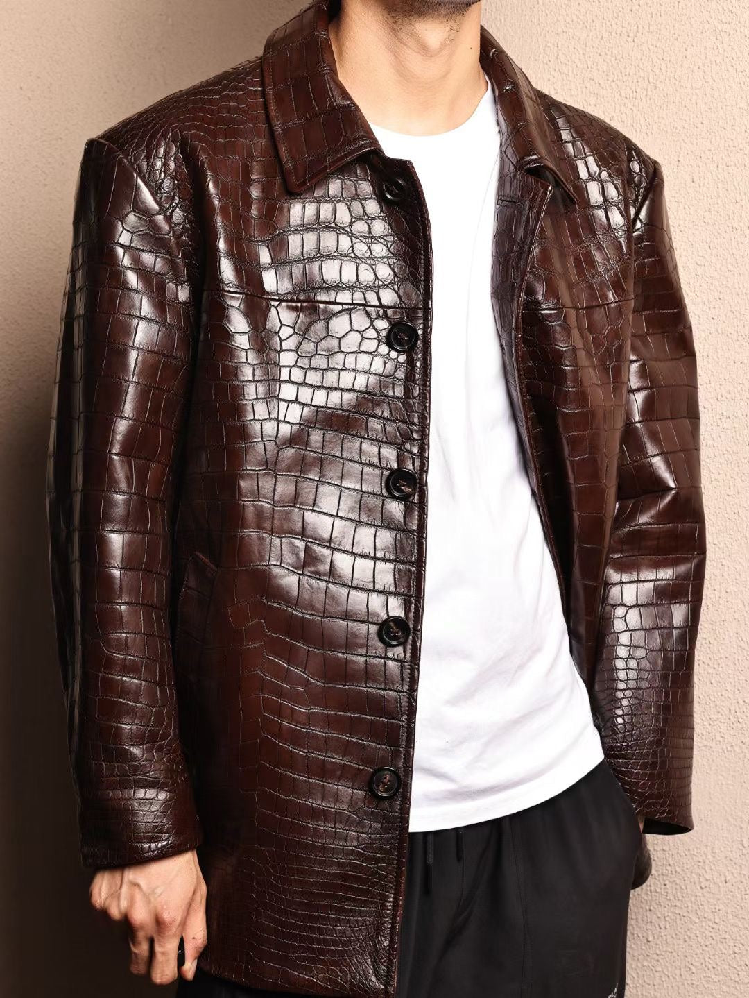 Men's mid-length crocodile leather jacket with Mandarin collar, formal style by Rossie Viren, featuring detailed crocodile skin texture.