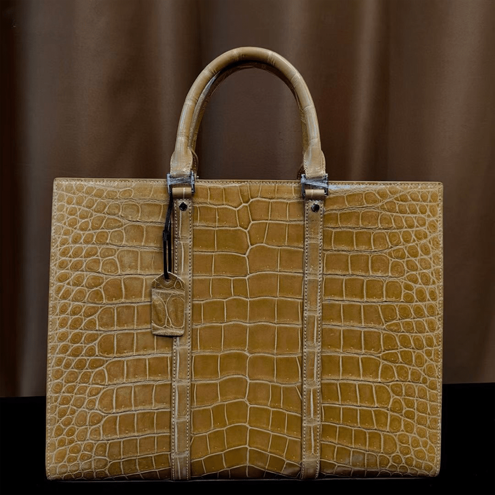 Rossie Viren crocodile leather briefcase with high-gloss finish, designed for laptops and business use, featuring a sleek crocodile skin texture.