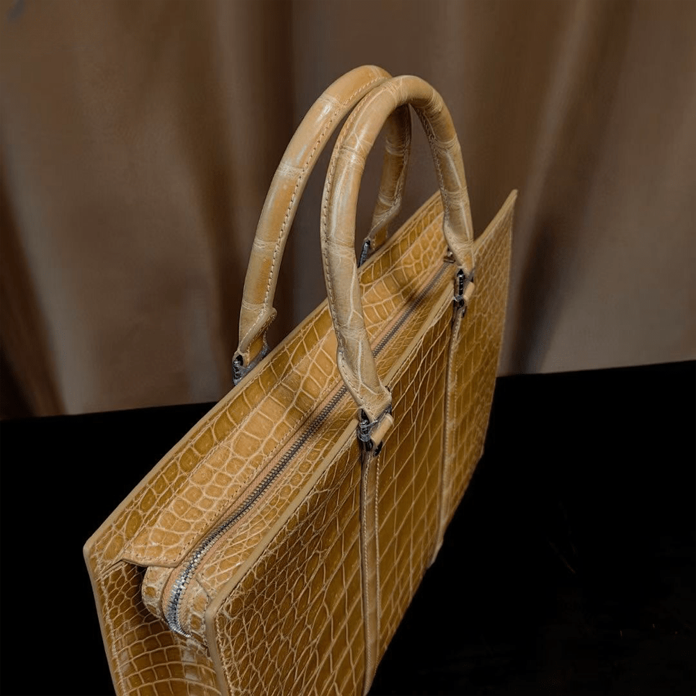 Rossie Viren crocodile skin leather briefcase with high gloss finish, designed for laptops and business use.