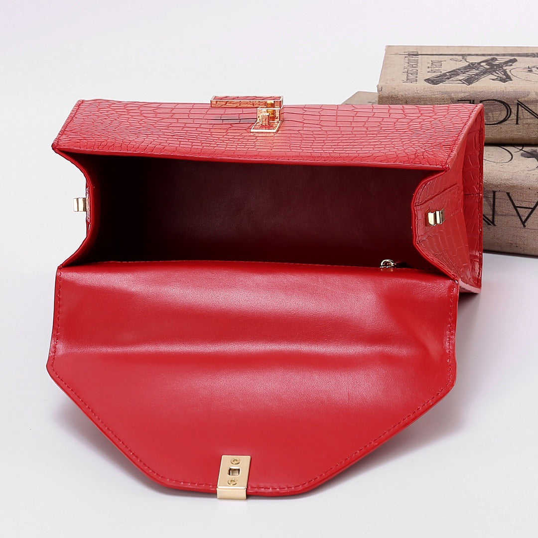 Red genuine crocodile skin leather top handle bag by Rossie Viren, featuring a sleek design and top handle for elegant carry.