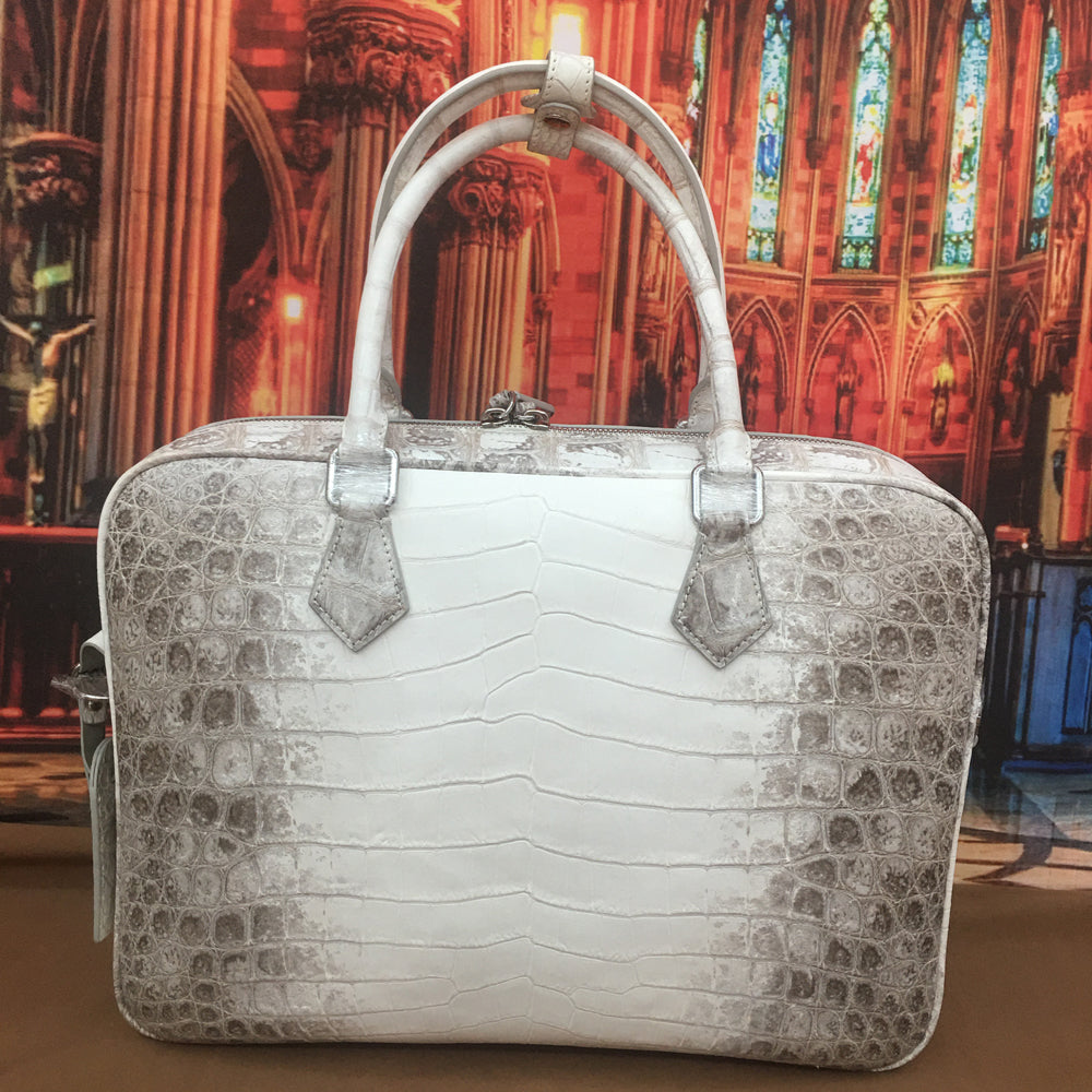 Genuine crocodile belly leather briefcase by Rossie Viren, featuring a sleek, handcrafted crocodile handbag with detailed texture.