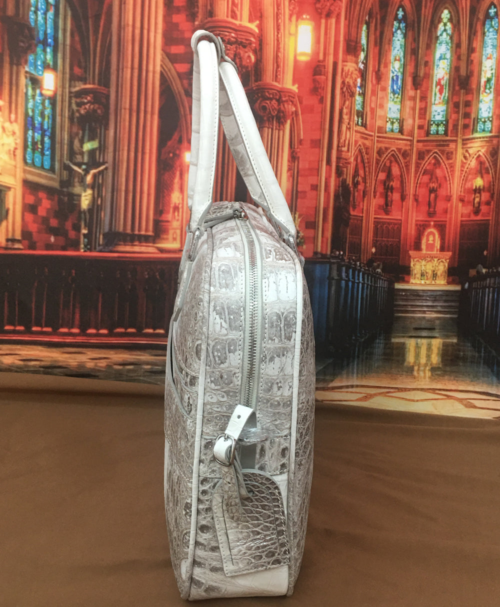 Genuine crocodile belly leather handbag by Rossie Viren, Himalayan crocodile briefcase with sleek, textured surface.