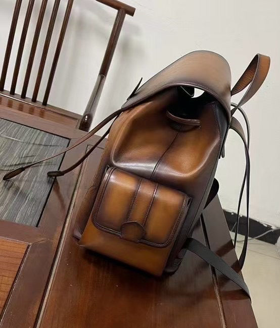 Vintage leather handbag by Rossie Viren featuring a classic design with sturdy leather straps and a spacious interior.