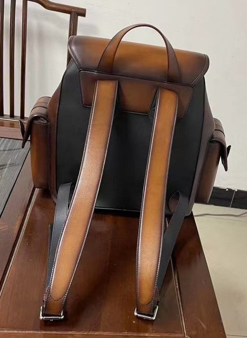 Vintage leather backpack handbag by Rossie Viren, showing durable brown leather with classic design and adjustable straps.