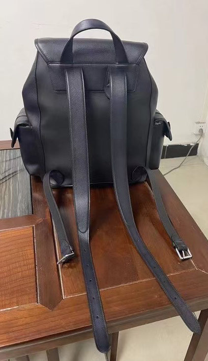 Vintage leather backpack handbag by Rossie Viren, featuring durable brown leather and classic design with adjustable straps.