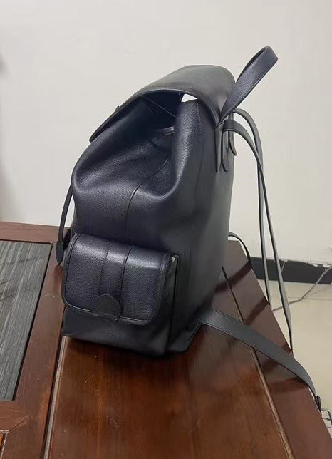 Vintage leather backpack handbag by Rossie Viren, showing durable brown leather with adjustable straps and classic design details.