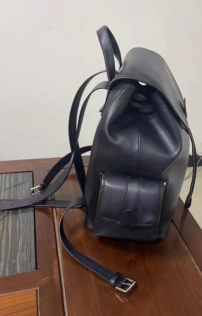 Vintage leather handbag by Rossie Viren featuring a spacious design and classic leather finish, shown with adjustable straps.