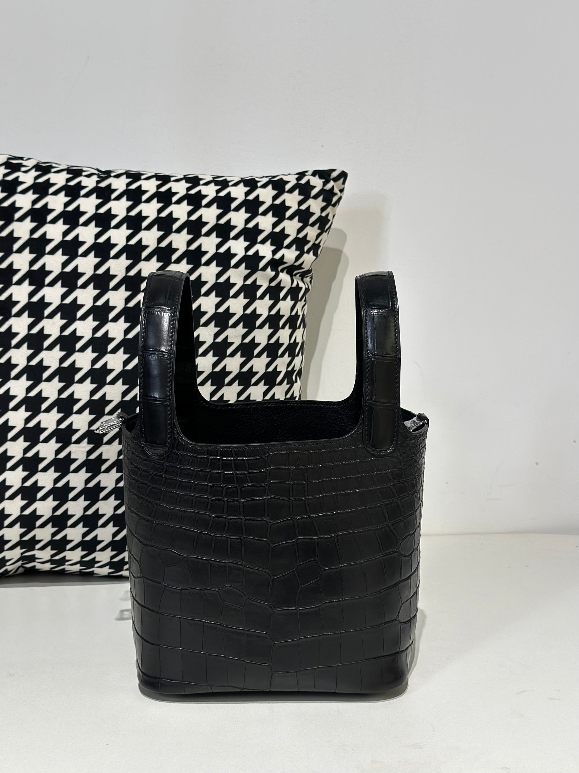 Women's black genuine crocodile leather cross body handbag by Rossie Viren, compact design with textured crocodile skin finish.
