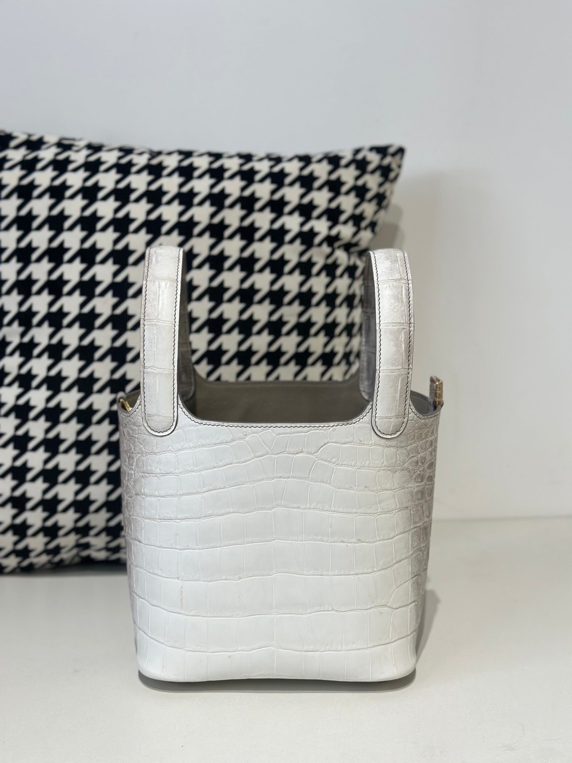 Women's genuine crocodile skin leather small crossbody handbag by Rossie Viren, featuring a compact design and textured surface.