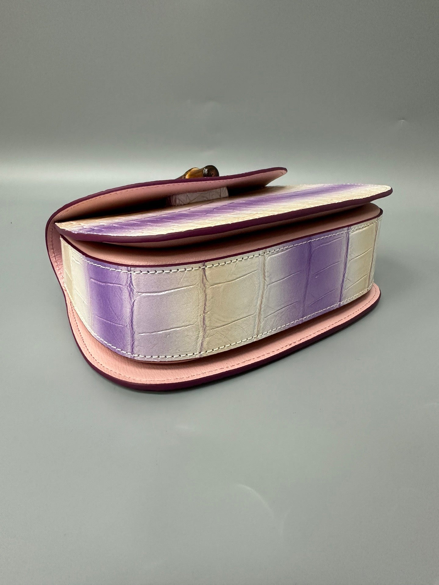 Rossie Viren brushed crocodile skin leather handbag with bamboo top handle, crossbody style, featuring textured crocodile pattern.