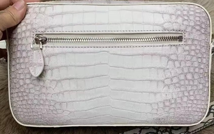 Rossie Viren Himalaya White genuine crocodile leather cross body bag with shoulder and clutch options, featuring textured crocodile skin.