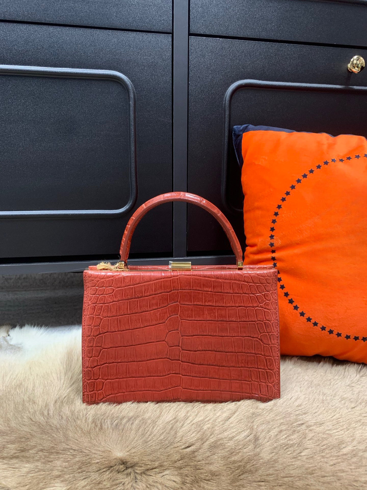 Rossie Viren crocodile leather evening clutch handbag with top handle, showcasing a sleek and elegant design.