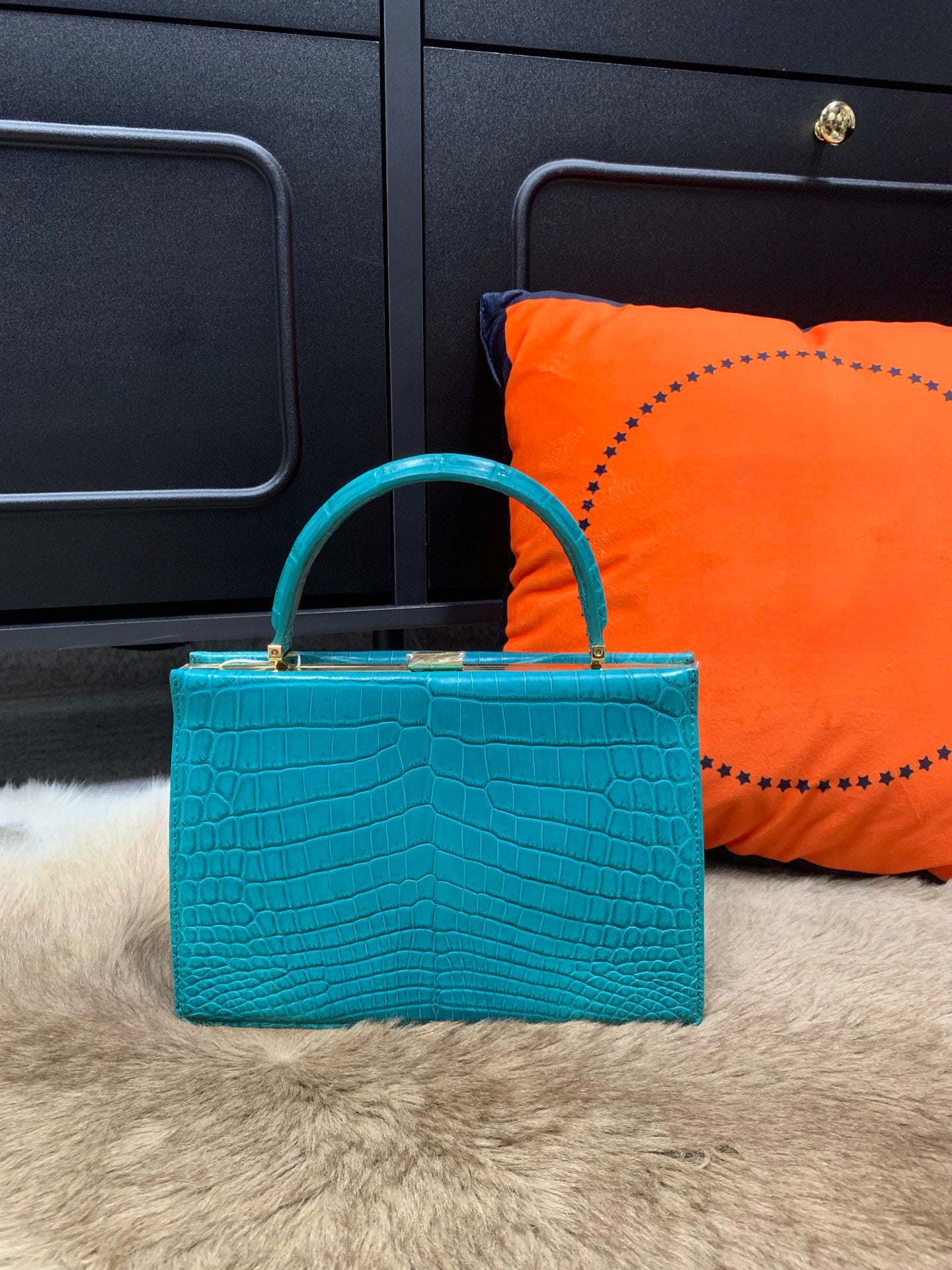 Rossie Viren crocodile leather evening clutch handbag with top handle, elegant design and textured crocodile pattern.