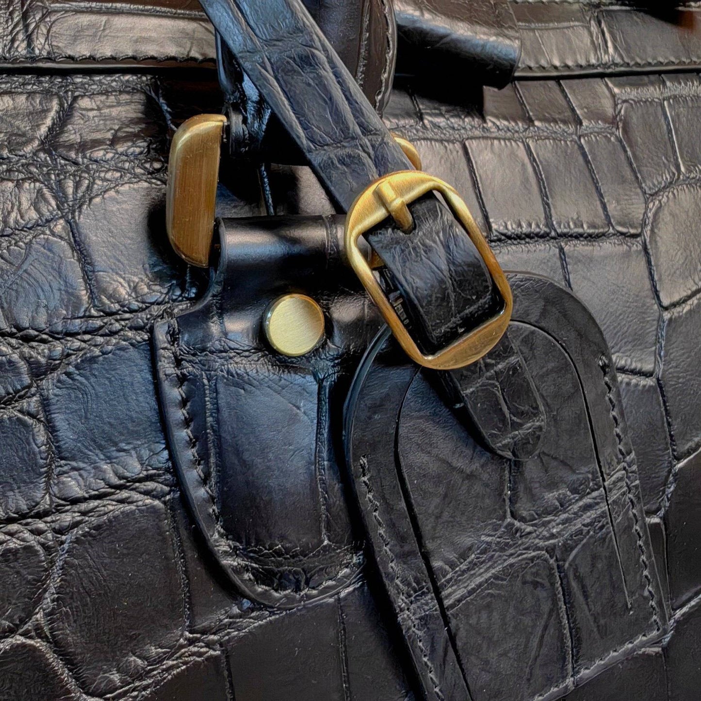Genuine crocodile leather large travel duffel bag by Rossie Viren, showcasing its textured surface and spacious design.