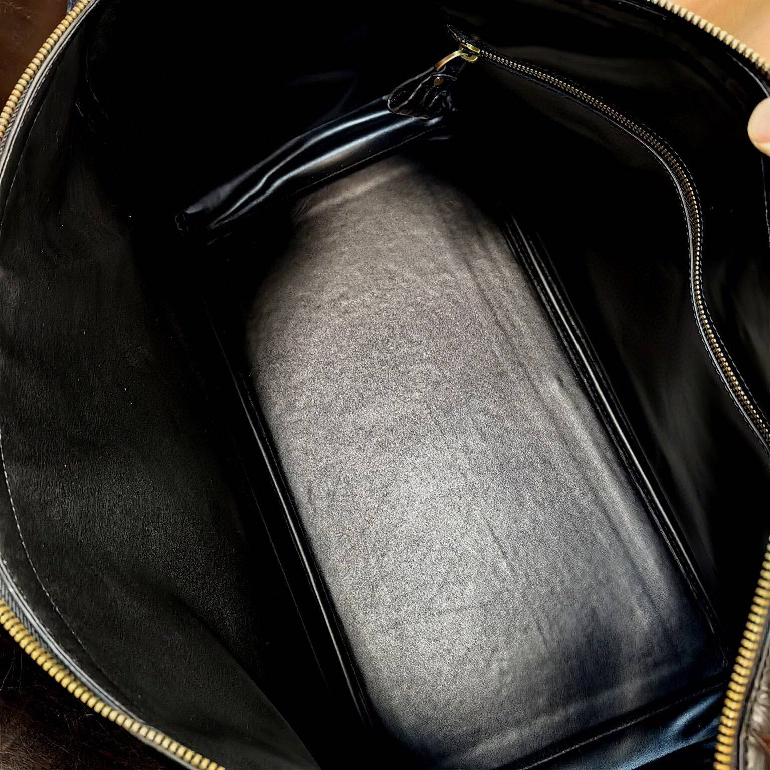 Genuine crocodile leather Rossie Viren super XL travel duffel bag with sturdy handles and spacious interior, designed for travel.