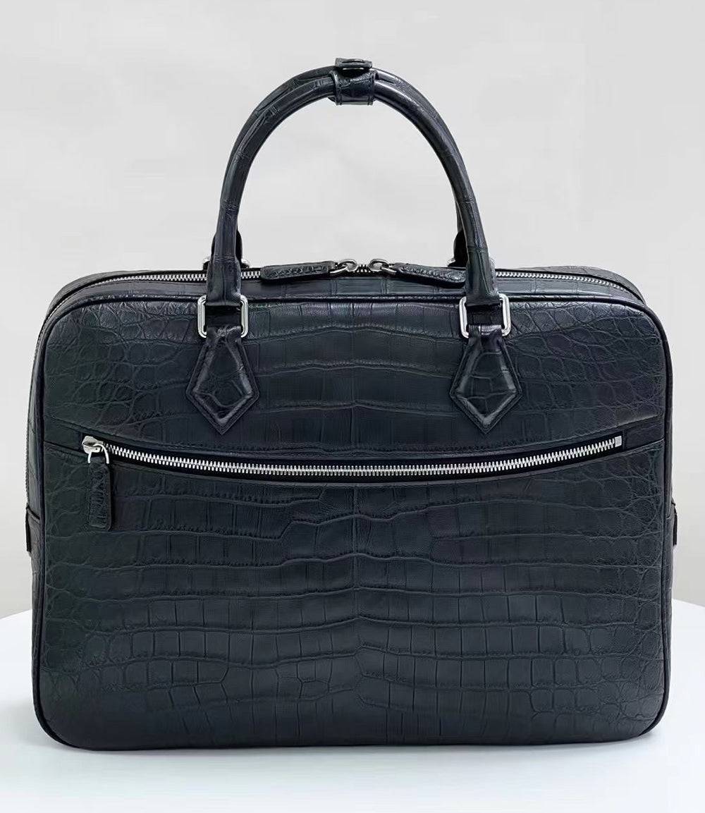 Genuine crocodile skin leather briefcase handbag by Rossie Viren with polished metal accents and sturdy handle.