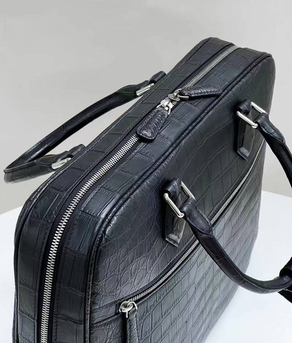 Genuine crocodile skin leather briefcase by Rossie Viren, featuring a sleek handbag design with polished hardware and textured surface.
