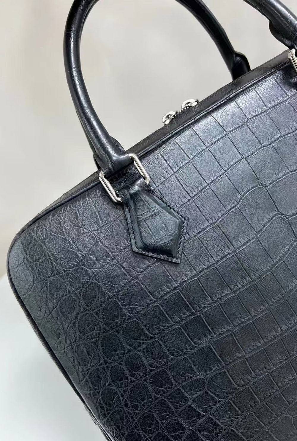 Rossie Viren genuine crocodile skin leather briefcase handbag with polished handle and textured surface.
