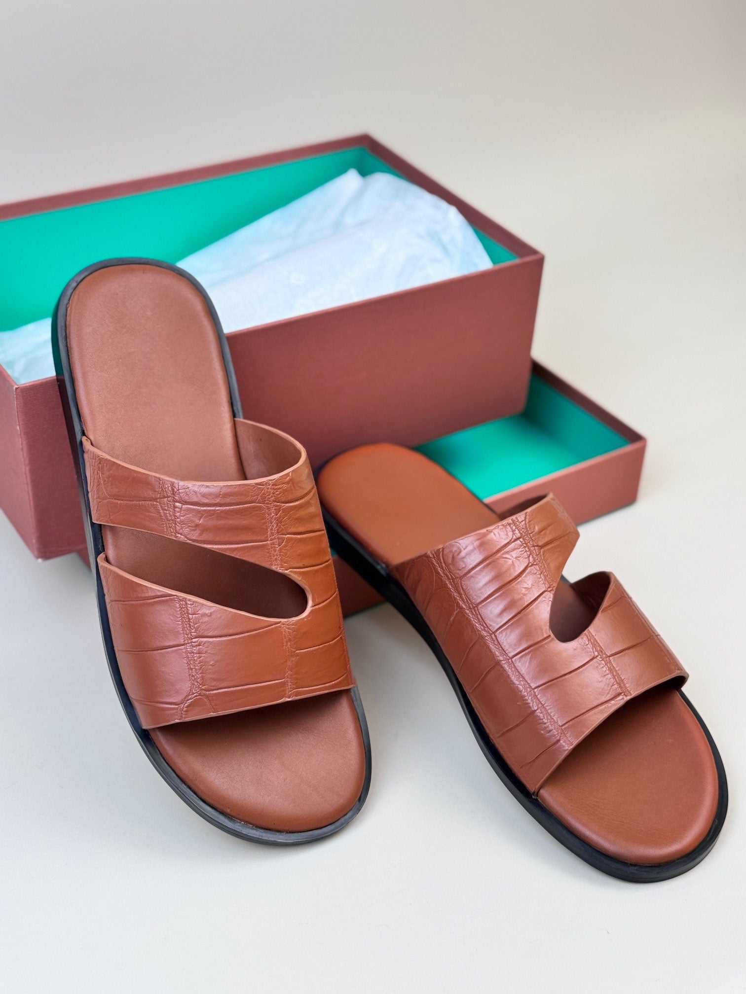 Men's crocodile leather slippers by Rossie Viren featuring textured crocodile skin and comfortable slip-on shoe design.