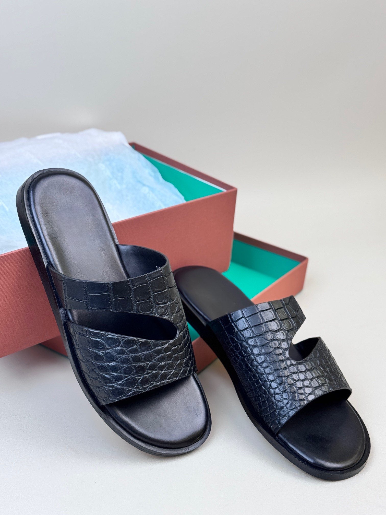 Men's crocodile leather slippers from Rossie Viren featuring sleek crocodile texture and comfortable slip-on design.