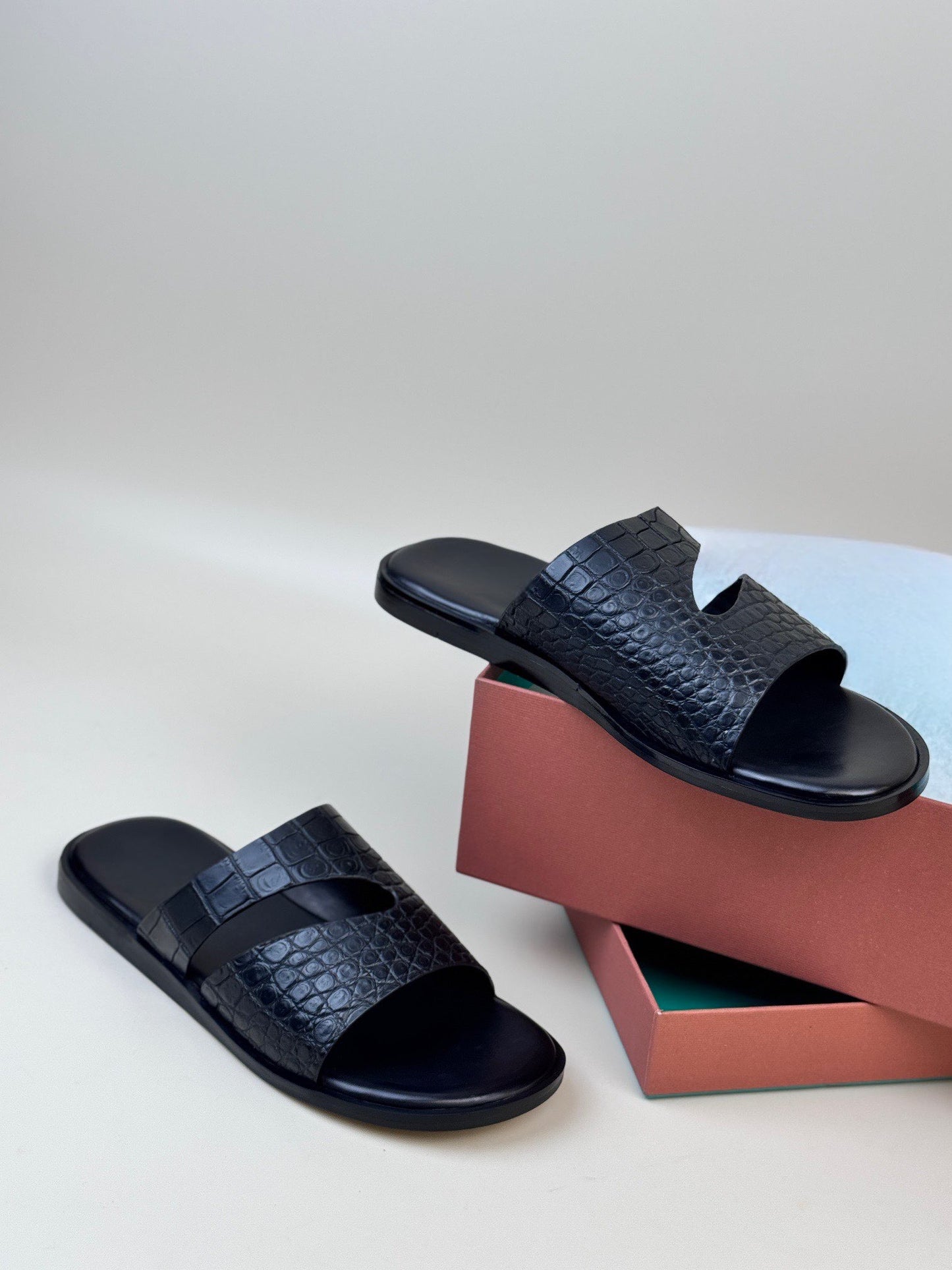 Men's crocodile leather slippers by Rossie Viren, featuring a sleek design and crocodile texture for stylish comfort.