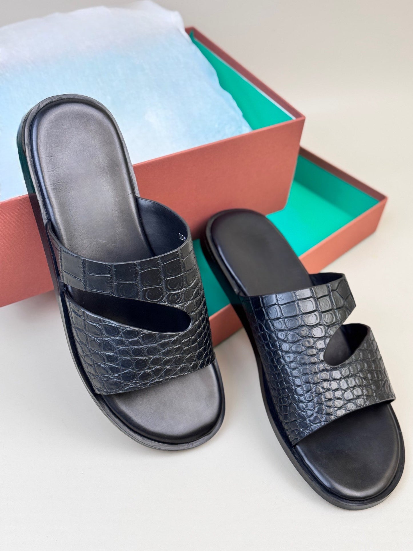Men's crocodile leather slippers from Rossie Viren featuring a sleek design and textured crocodile pattern.