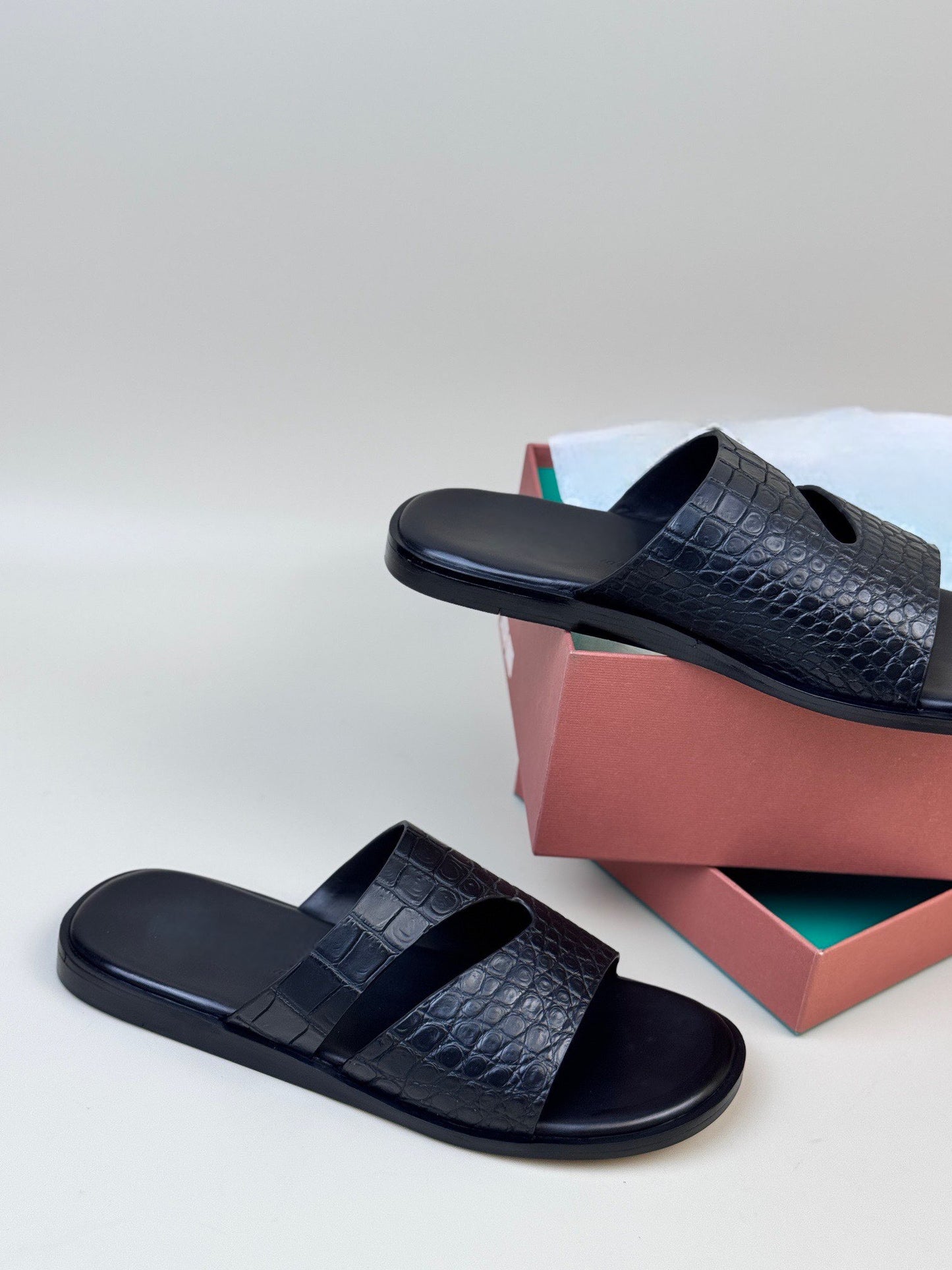 Men's Crocodile Leather Slippers by Rossie Viren, featuring textured crocodile pattern and comfortable slip-on shoe design.