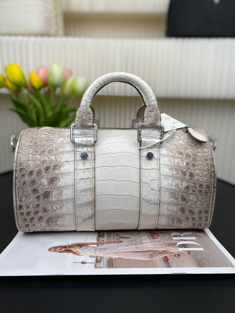 Unisex Himalaya white genuine crocodile leather Boston satchel bag by Rossie Viren with handles and textured crocodile skin appearance.