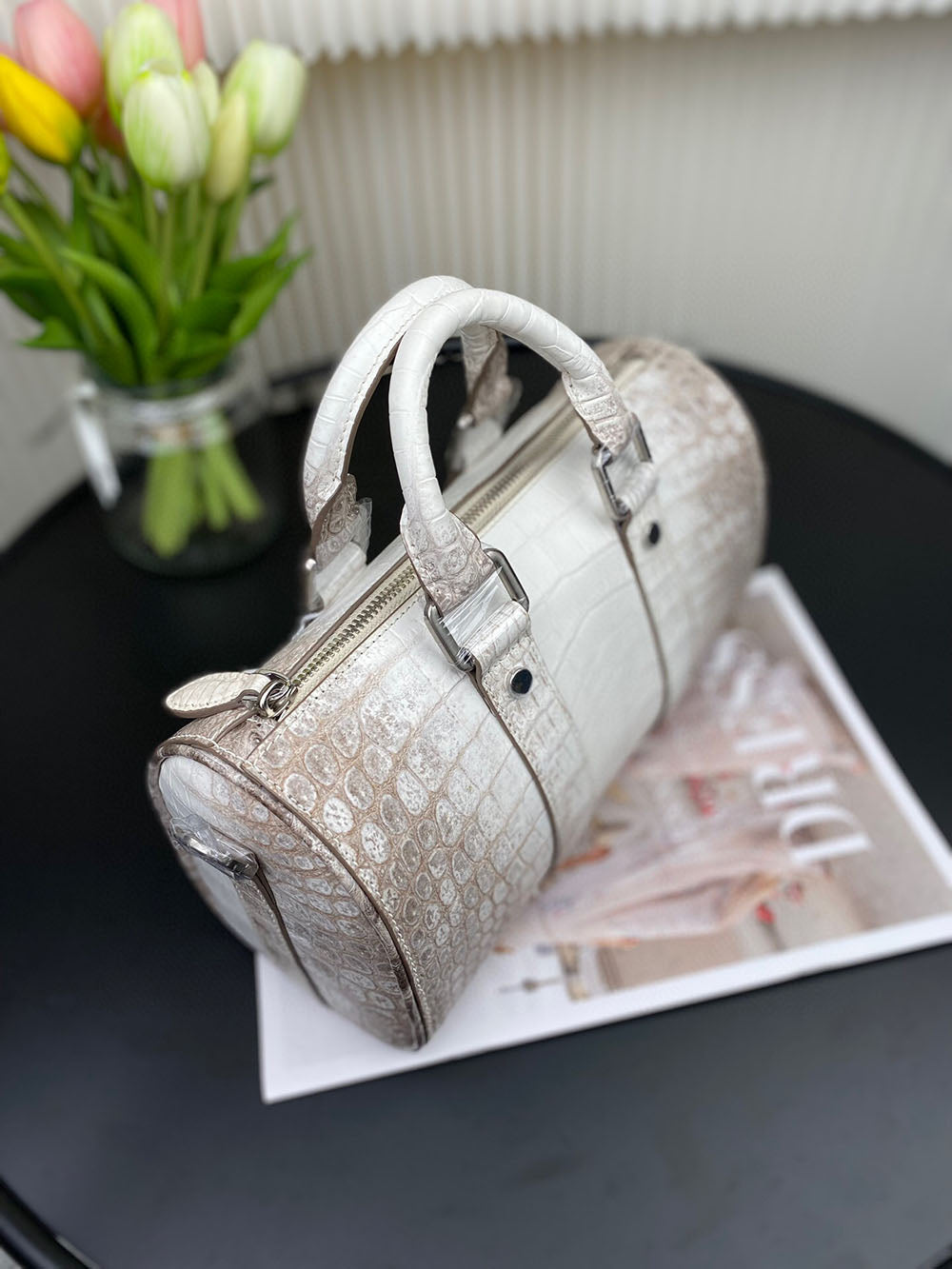 Unisex Himalaya white genuine crocodile skin leather Boston satchel bag by Rossie Viren with handles and textured crocodile pattern.