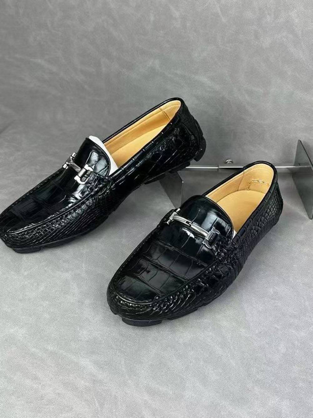 Black croc-embossed leather men's penny loafer dress shoes by Rossie Viren, featuring sleek crocodile texture and classic slip-on design.