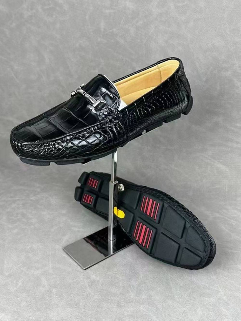 Black crocodile leather men's penny loafer dress shoes by Rossie Viren, showcasing the textured crocodile pattern and classic loafer design.